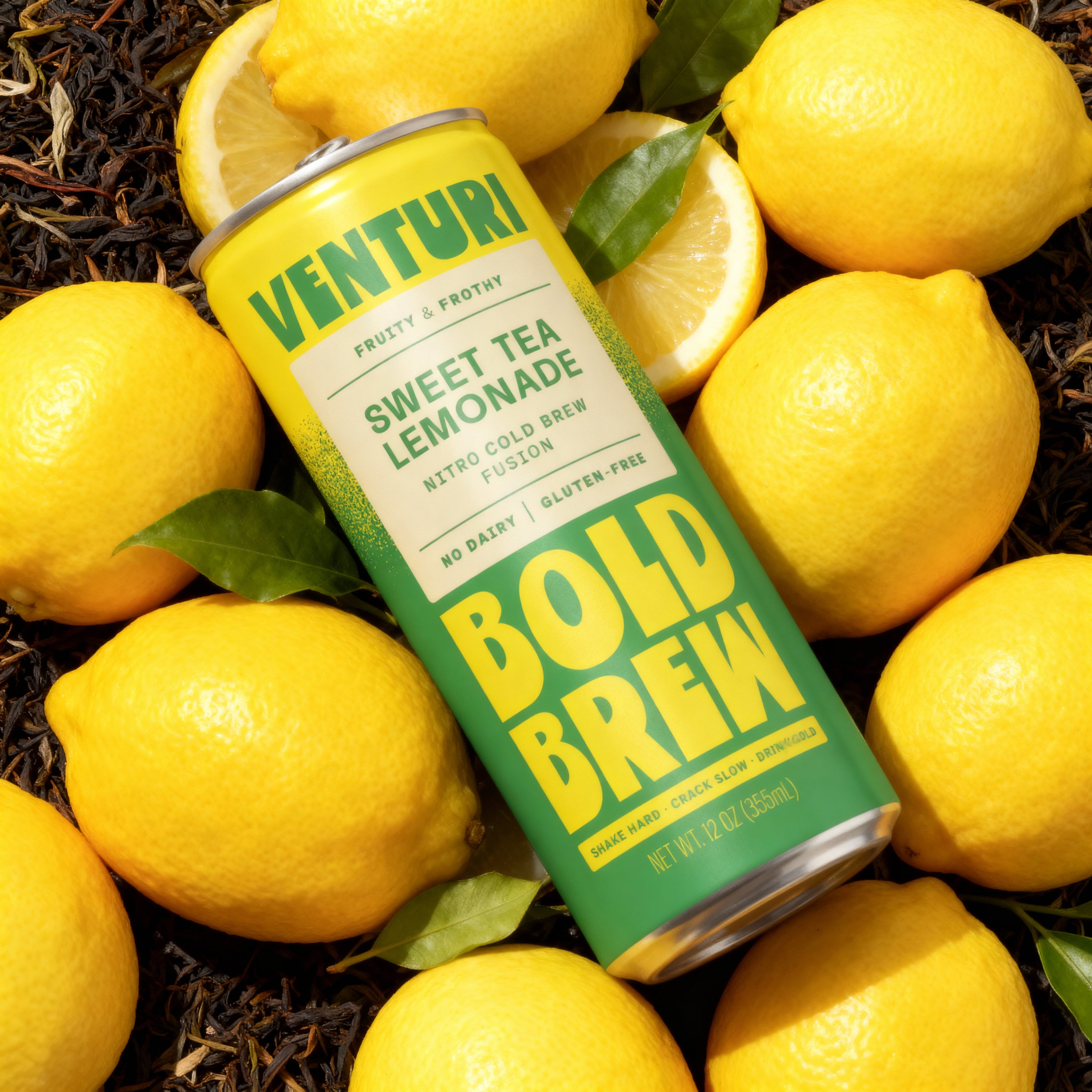Venturi Sweet Tea Lemonade can surrounded by lemons on a bed of tea leaves.